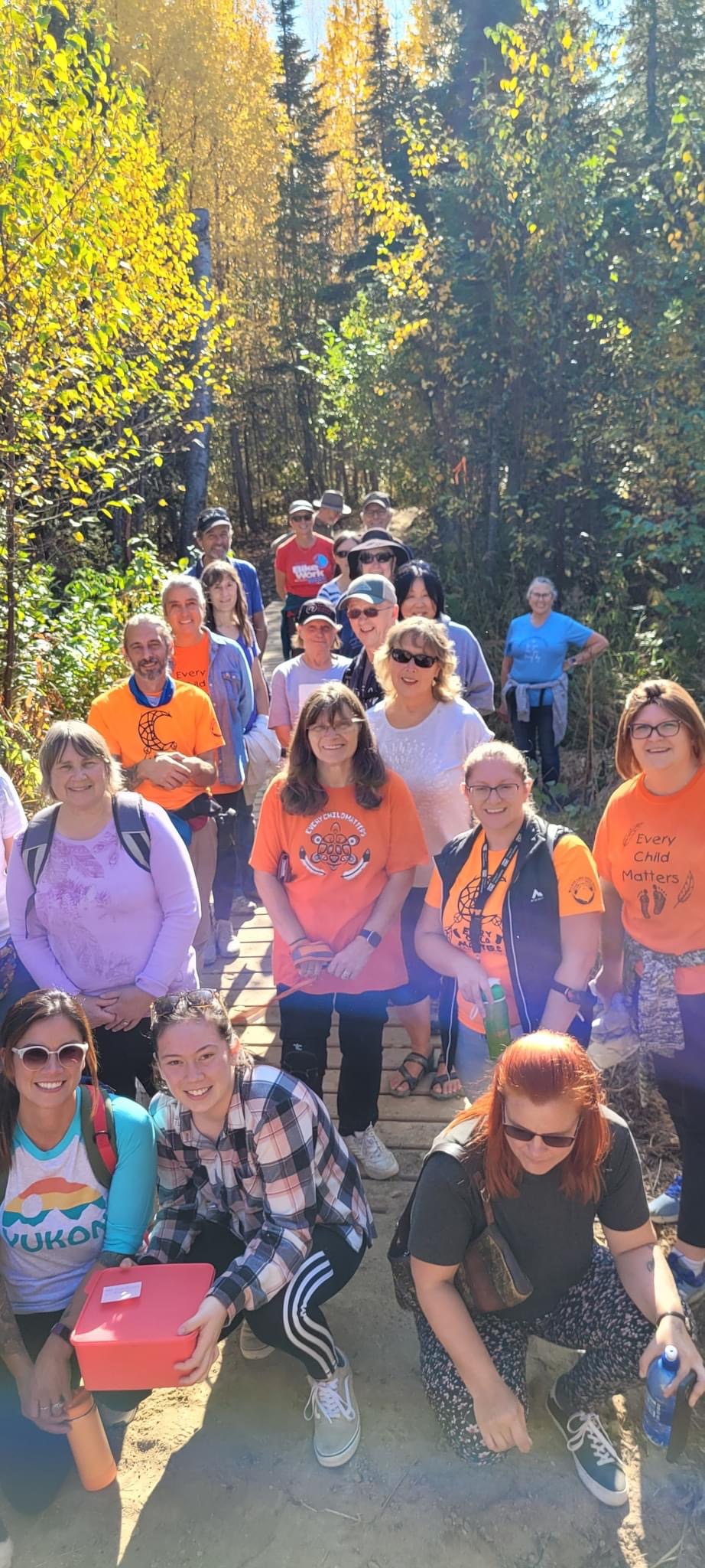 Members and volunteers walking together outdoors