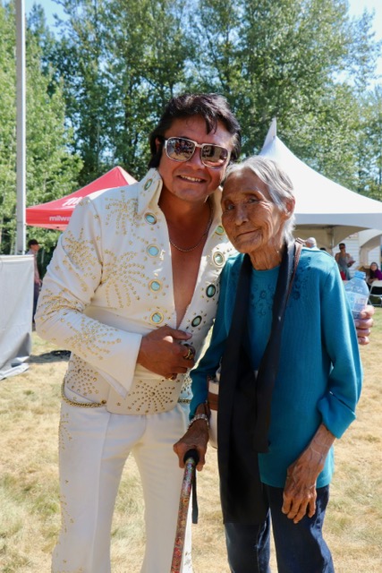 Two members dressed up smiling at a costume event