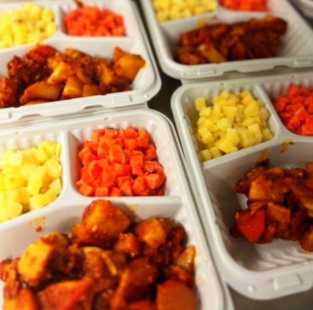 Colourful prepared frozen meal containers ready for delivery